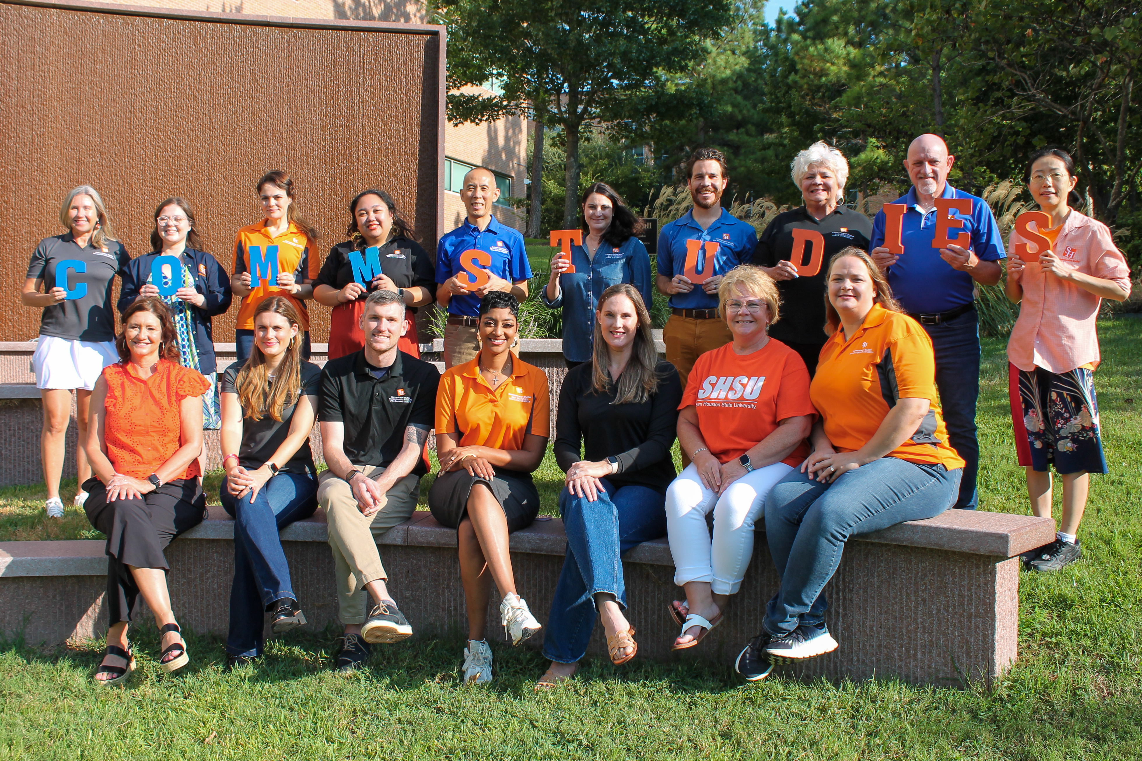 2024 faculty group photo by waterwall on campus