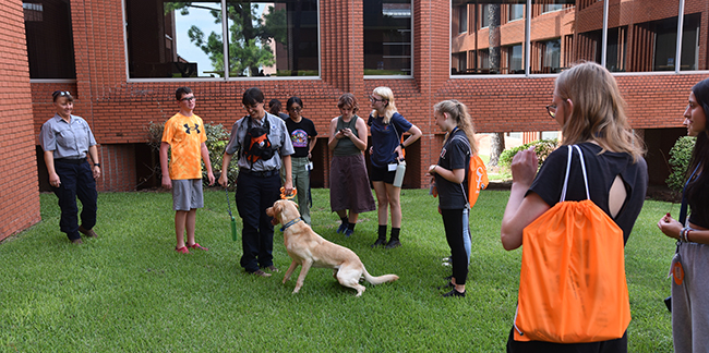 Group of Summer camp attendees  with dog