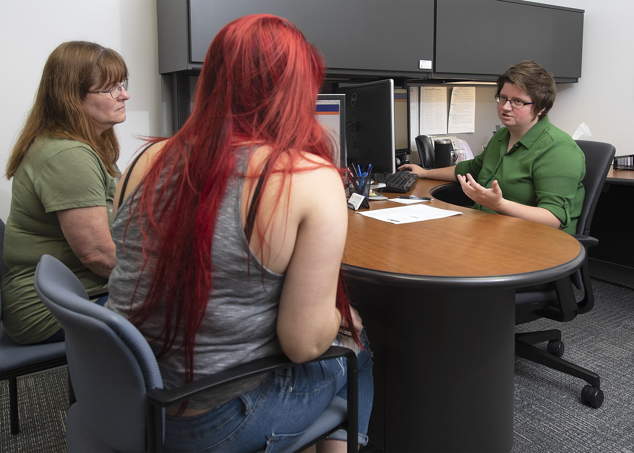 Student and parent being advised together.