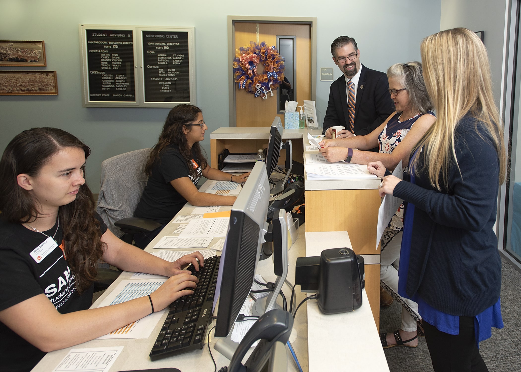 Getting help at front desk of SAM Center.