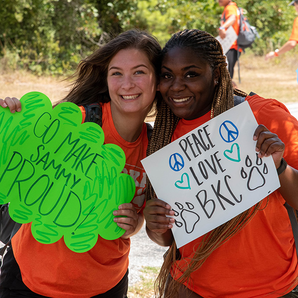 counselors holding signs