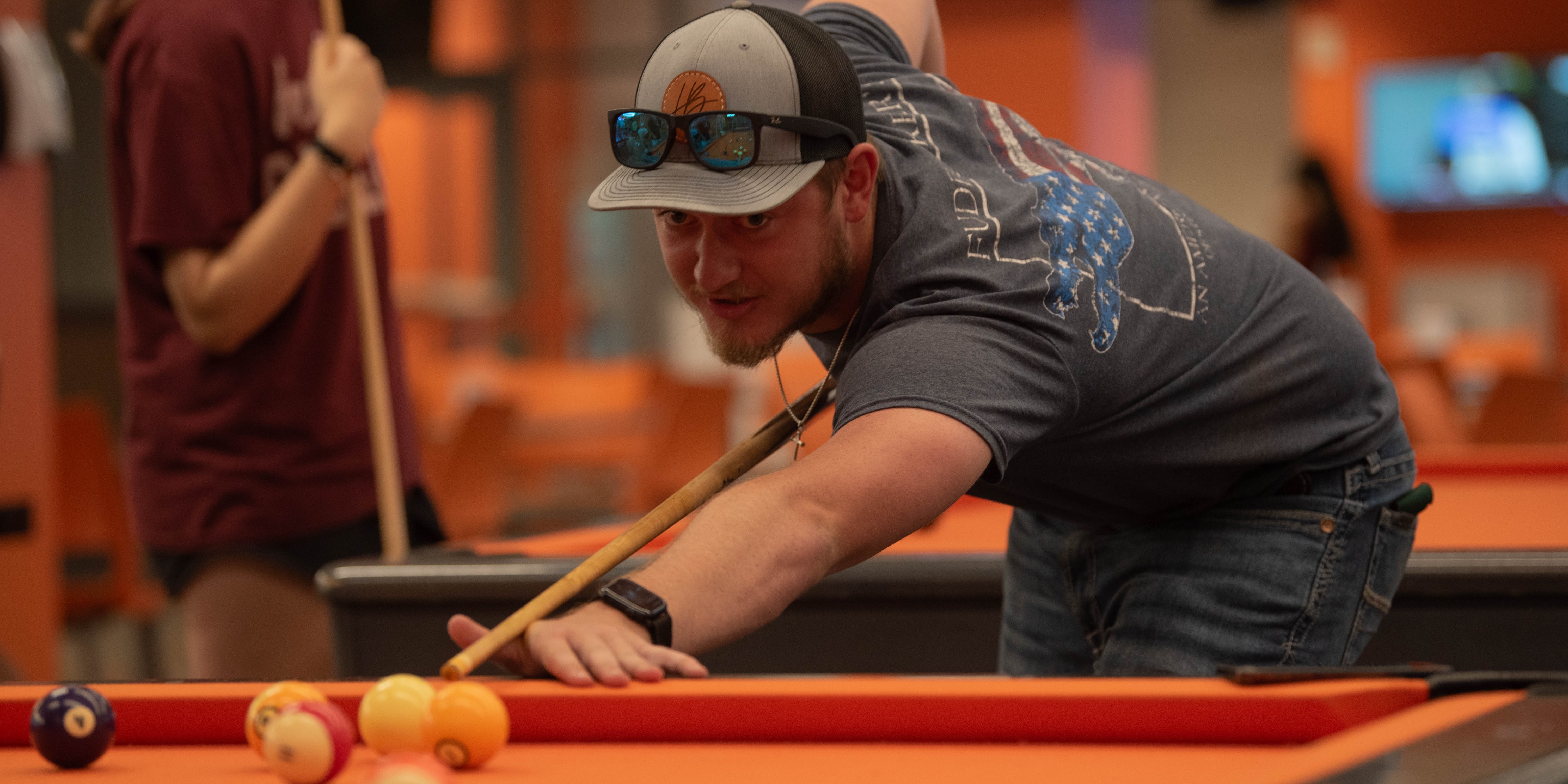 guy playing pool